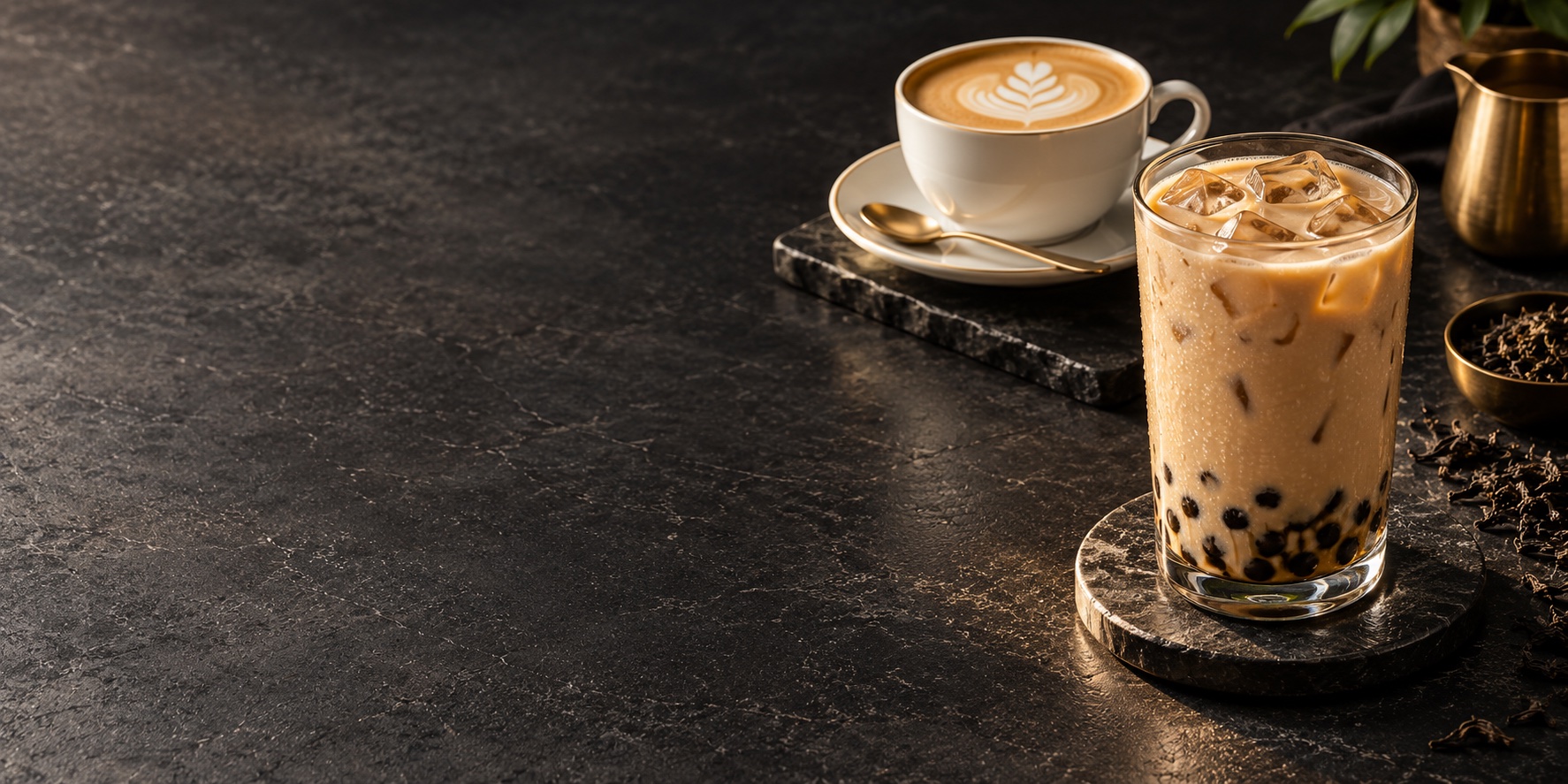 Illustrative coffee and iced tea study on a dark tabletop; not Corner Cafe menu photography
